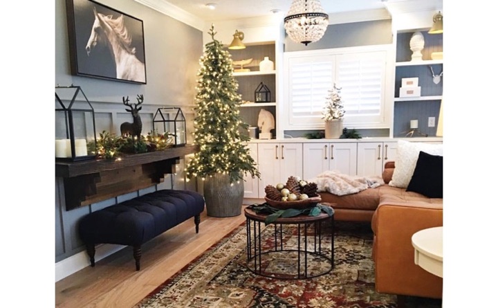 Living room with horse painting and shutters.